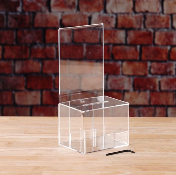 A clear Acrylic donation / ballot box showcases how to open box