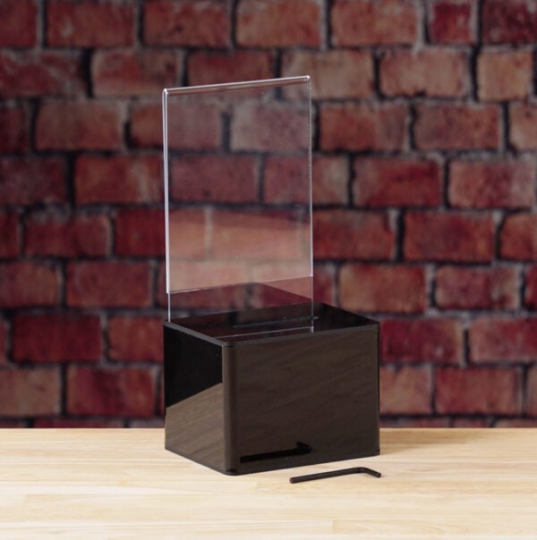 A Black Acrylic donation / ballot box showcases how to open box