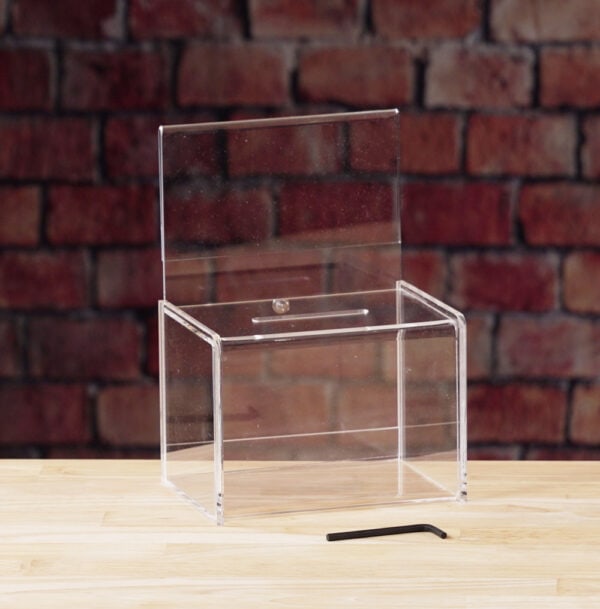 A Clear Acrylic donation / ballot box showcases with allen wrench lock