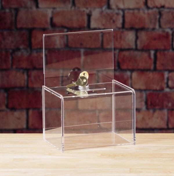 A Clear Acrylic donation / ballot box showcases with keyed lock